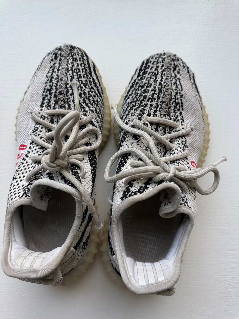 Yeezy Kids Zebra Knit Sneakers in Cream, Black with Red Accent